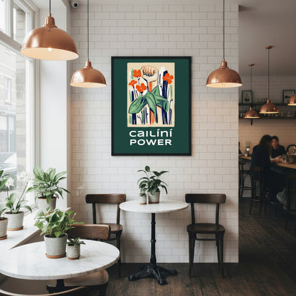 Cailíní Power feminist art hanging in an independent Irish café with white subway tiles, copper lighting, small round marble tables and plants.