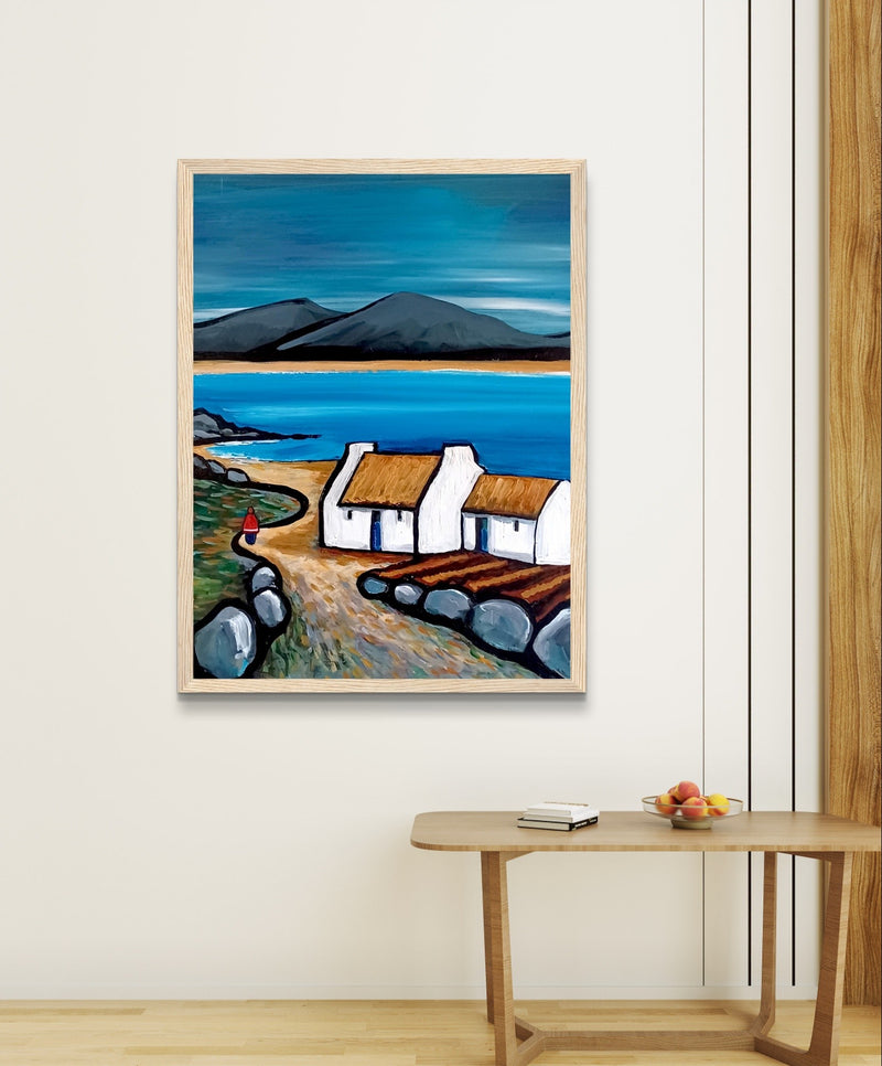 Framed art print titled Connemara Lakes Cottage" by Irish artist Ó Maoláin. Features a serene lakeside cottage in Connemara's picturesque countryside, capturing Ireland's rustic beauty with rolling hills, tranquil waters, and vibrant colours.