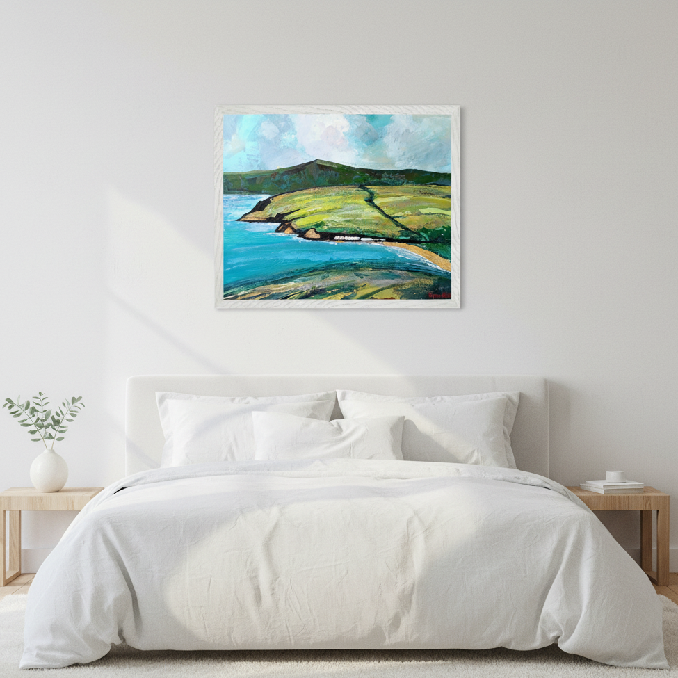 Cushendun Landscape by Ó Maoláin framed Irish art print above a bed with white linen bedding