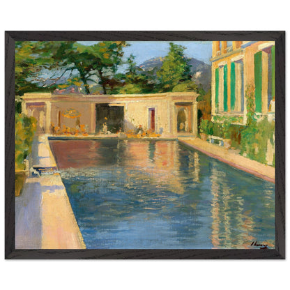framed print of “Swimming Pool, Southern France” hanging in a sunlit Mediterranean-style interior with warm stucco walls, olive plants, soft coastal light, and a premium black hardwood frame.